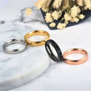 Polished stainless steel couple rings set in silver, gold, black, and rose gold finishes