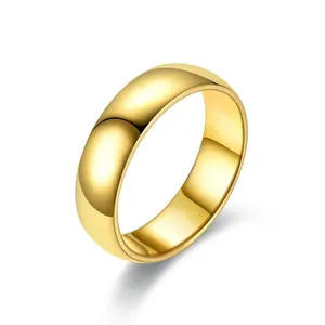 Macro detail of high-polished gold-plated stainless steel dome ring with reflective surface