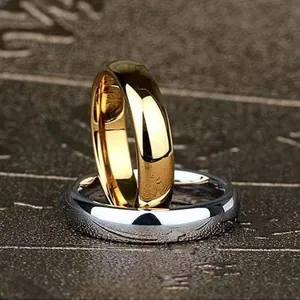 Close-up of gold and silver stainless steel rings with a polished mirror finish
