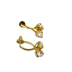 Elegant gold flower bud stud earrings with minimalist white freshwater pearls