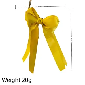 Elegant bright yellow satin bow hair clip with long ribbons, 15cm x 20cm design