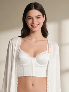 Close-up of white satin corset top with delicate lace trim and front hook closure