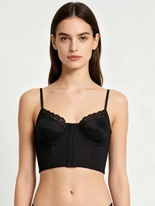 Detail view of black satin corset bra with delicate lace trim and vertical stitching