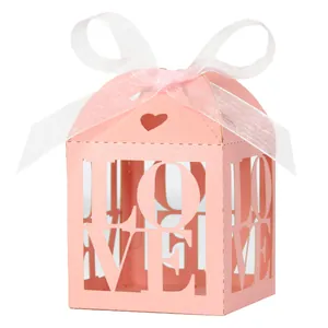 Pink laser cut wedding candy box with LOVE letters and white organza ribbon bow