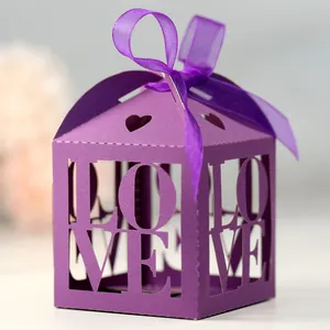 Detailed close-up of purple LOVE cutout candy box with silk ribbon bow and heart design