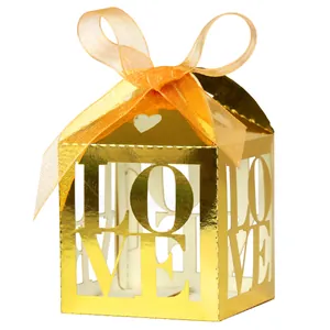Hollow Love ivory candy box with gold foil finish and orange ribbon for wedding favors