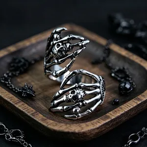 Retro gothic skull hand ring in vintage silver finish with a punk skeleton design
