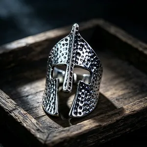 Detailed macro view of a vintage Spartan helmet ring with a distressed silver finish