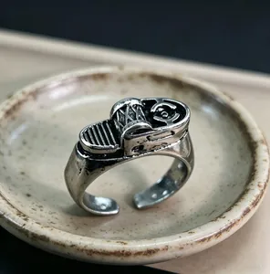 Close-up of vintage industrial ring with mechanical motifs and antique silver finish