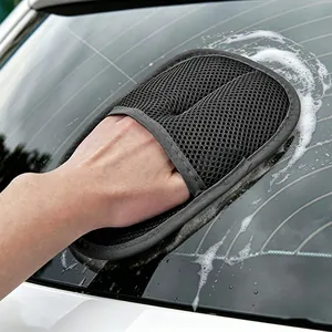 Professional car wash mitt for cleaning and waxing car windows with foam.