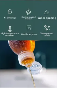 Macro view of drip-free oil dispenser pouring liquid with a large diameter neck
