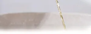Close-up of leak-proof oil dispenser bottle showing smooth squeeze pour mechanism