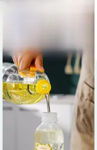 Detail of the wide-mouth kitchen oil dispenser bottle for easy mess-free refilling