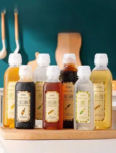 Close-up of kitchen condiment bottles with waterproof English and Chinese labels on wood