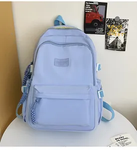 Detail view of the lavender school backpack with woven zipper pulls and side buckles