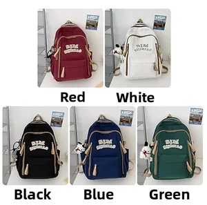 Five minimalist canvas backpacks in red, white, black, blue, and green color options