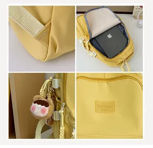 Detailed view of yellow school backpack featuring durable straps and spacious iPad compartment