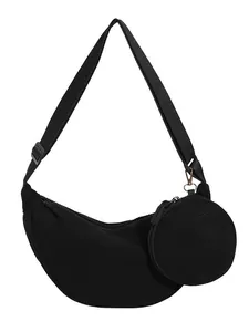 Black corduroy crescent handbag with adjustable strap and a small round coin purse
