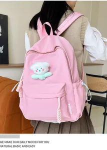 Sac à dos en nylon rose imperméable avec charm peluche et cordons de serrage latéraux