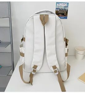 Rear view of white waterproof backpack with khaki straps and wide ergonomic shoulder design