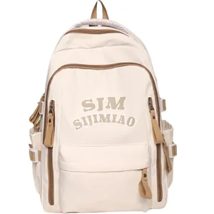 Minimalist beige large capacity nylon backpack with brown zipper details and adjustable straps