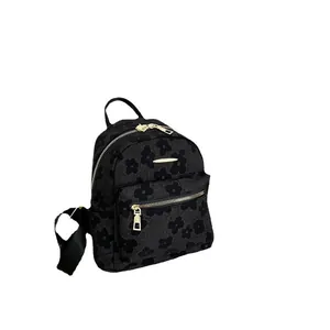 Chic black jacquard backpack with 3D floral pattern and golden zipper detail