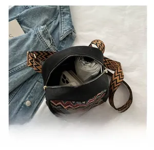 Ethnic canvas shoulder bag with boho pattern showing interior space for phone and umbrella