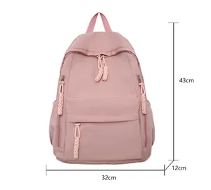 Pink student backpack dimensions detail showing 43cm height and water-resistant nylon fabric