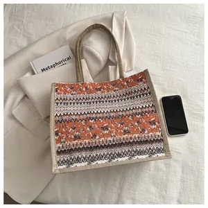 Close-up of bohemian linen tote bag with geometric patterns and natural texture
