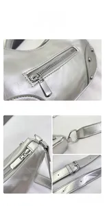 Close-up of silver rivet details and metallic wrinkled leather texture on a shoulder bag