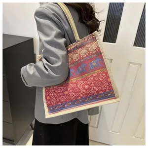 Detail of bohemian tote bag featuring ethnic elephant print on durable burlap canvas