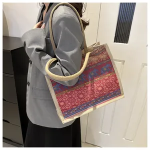 Bohemian linen tote bag with elephant pattern and rope shoulder straps on model