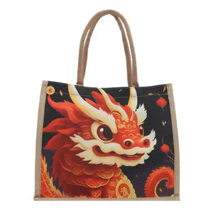 Black burlap tote bag featuring a vibrant red cartoon dragon and woven rope handles