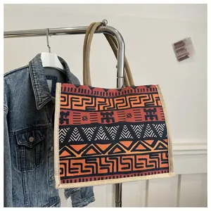 Detail of bohemian tote bag with tribal geometric patterns and thick cotton rope handles