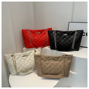 Detailed group view of quilted tote bags in red, black, white, and khaki colors