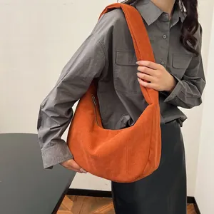 Orange corduroy hobo shoulder bag with drawstring pleats for casual daily style