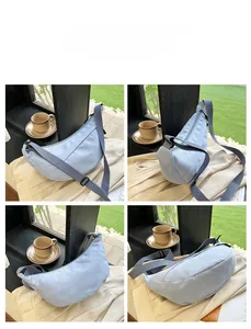 Detailed views of light blue nylon crescent crossbody bag with adjustable gray strap