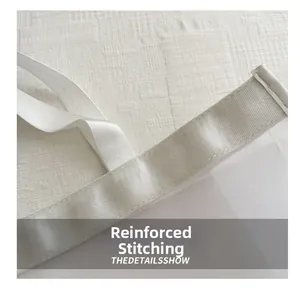 Detail view of reinforced stitching on white mesh shopping bag handle and seams