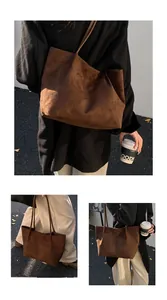 Macro view of a large brown vintage tote bag made from premium faux suede material