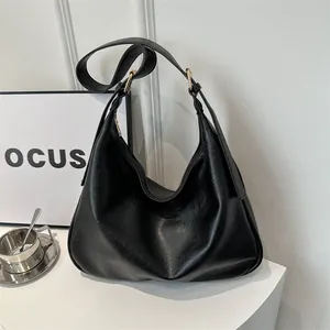 Black large capacity faux leather hobo bag with gold hardware for women, minimalist style