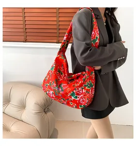 Close-up of ethnic tote bag with traditional Chinese red peony floral pattern
