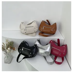 Detailed view of five colorful rivet dumpling bags with vintage cracked texture leather