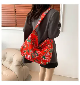 Detailed shot of ethnic red floral pattern tote bag showing its large capacity and drape