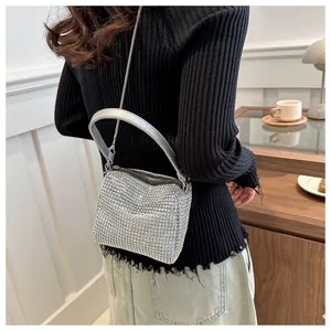 Close-up of sparkling silver rhinestone evening bag with elegant chain and top handle