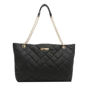 Large capacity black quilted tote bag with golden chain straps and diamond pattern