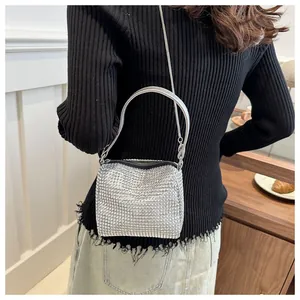Detail of silver rhinestone mesh evening bag with metallic chain and sparkling texture