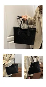 Dettaglio della borsa tote nera leopardata con scritta FASHION e manici lunghi in pelle