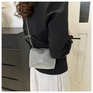 Detailed back view of a luxury mini silver rhinestone evening bag with chain strap