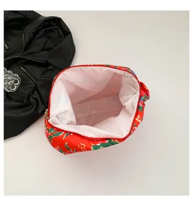 Detailed interior of ethnic floral tote bag showing white lining and red zipper top