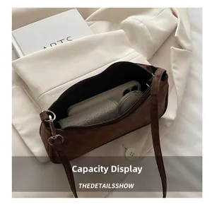 Detail showing internal capacity for phone and makeup inside leopard print bag